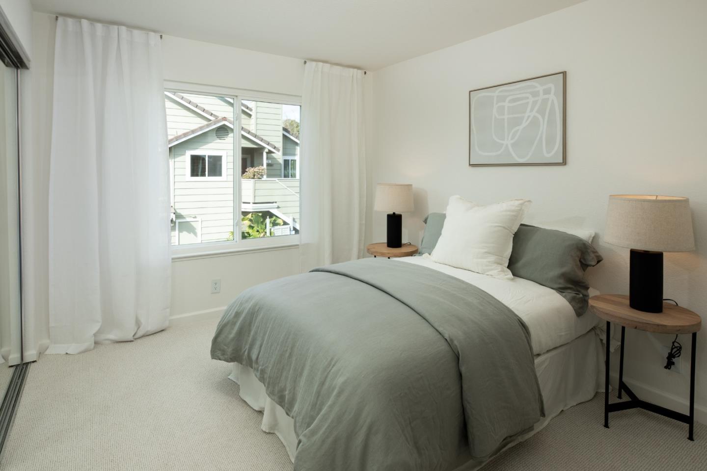 40 Cherryton Lane San Jose, CA 95136 - Photo 14 of 27 a bedroom with a bed and two windows