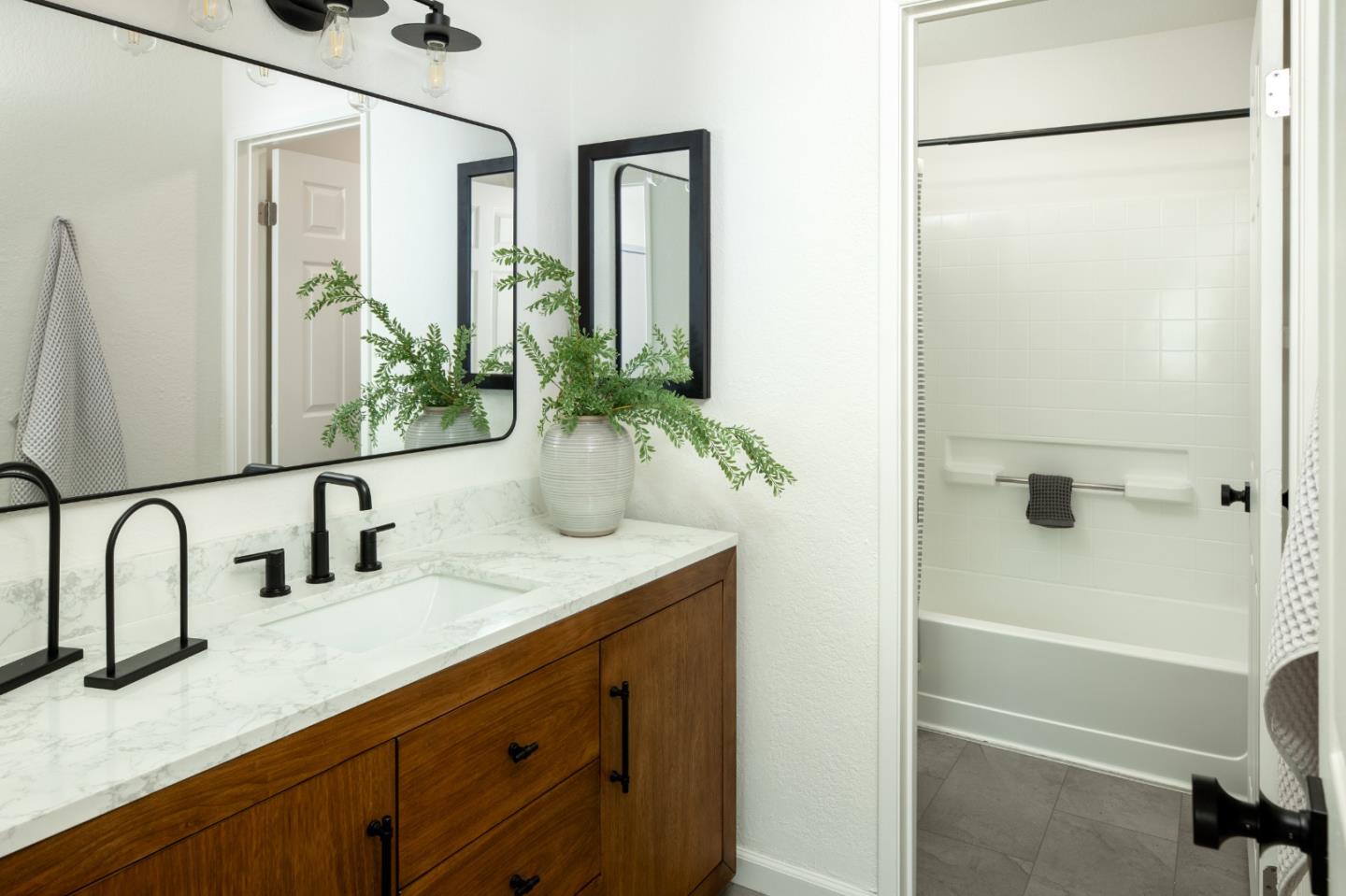 40 Cherryton Lane San Jose, CA 95136 - Photo 15 of 27 a bathroom with a granite countertop sink and a mirror