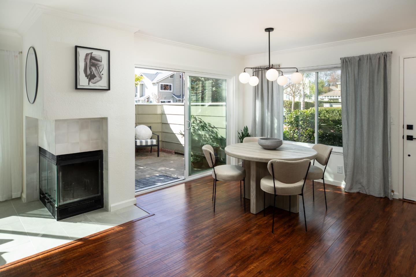 40 Cherryton Lane San Jose, CA 95136 - Photo 6 of 27 a dining room with furniture window fireplace and wooden floor