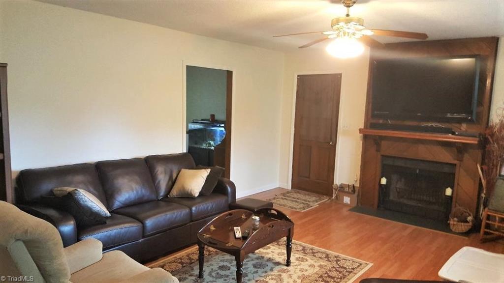 7013 Harperglen Road Clemmons, NC 27012 - Photo 2 of 16 Living Room with wood burning fireplace