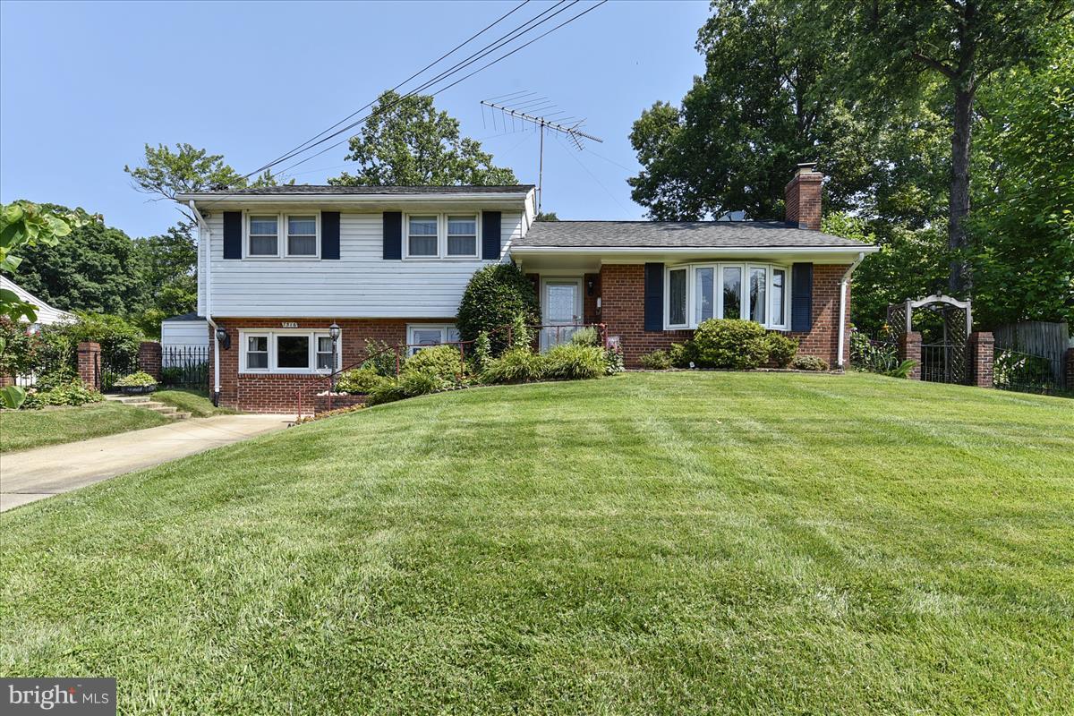 7516 Inzer Street Springfield, VA 22151 - Photo 1 of 30 a front view of a house with garden