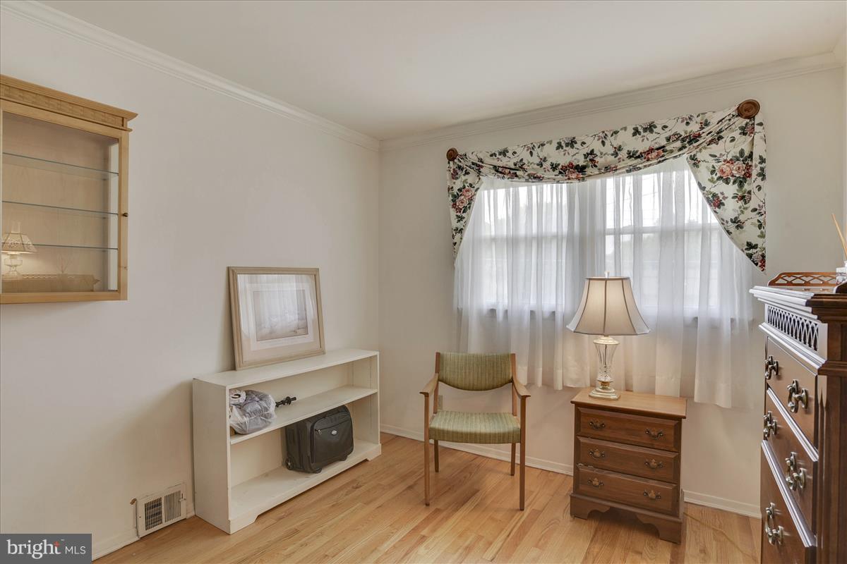 7516 Inzer Street Springfield, VA 22151 - Photo 17 of 30 a living room with furniture and a fireplace