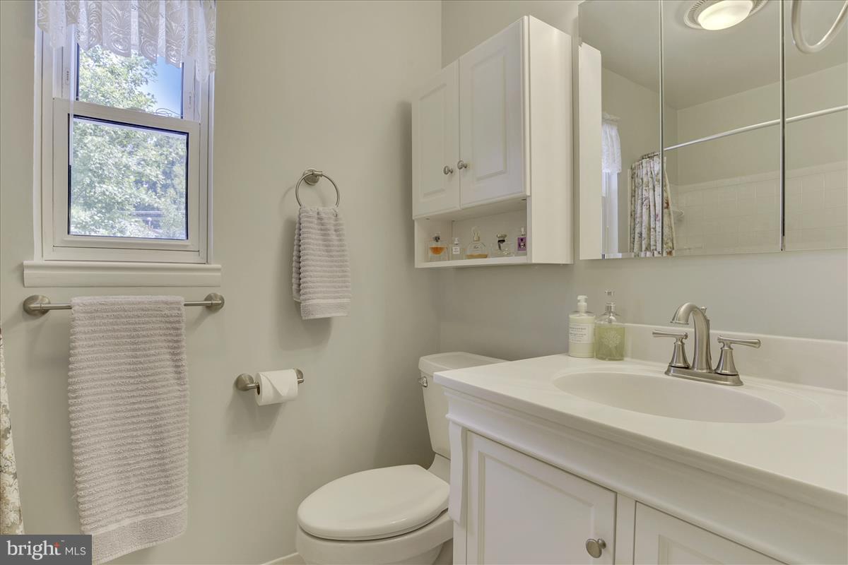 7516 Inzer Street Springfield, VA 22151 - Photo 18 of 30 a bathroom with a sink a toilet and shower