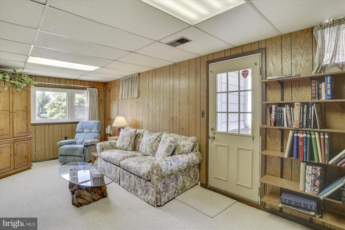 7516 Inzer Street Springfield, VA 22151 - Photo 21 of 30 a living room with furniture cabinets and a window