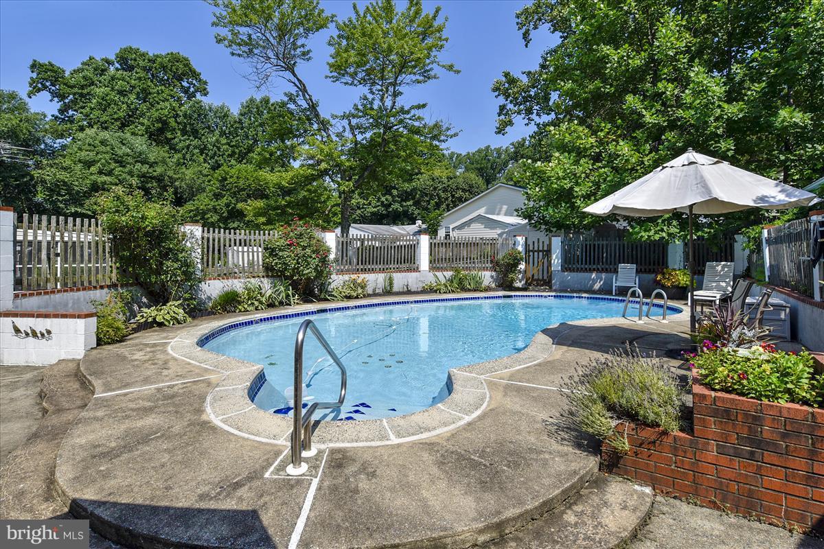 7516 Inzer Street Springfield, VA 22151 - Photo 26 of 30 a view of a backyard with sitting area and furniture