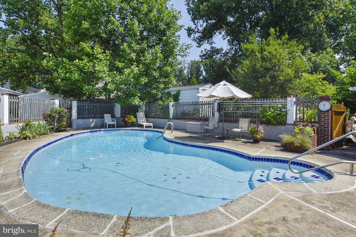7516 Inzer Street Springfield, VA 22151 - Photo 27 of 30 a view of a house with backyard and sitting area