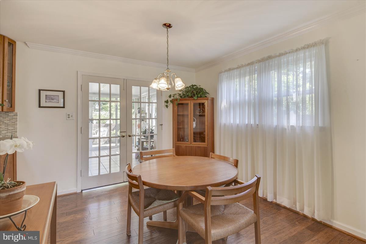 7516 Inzer Street Springfield, VA 22151 - Photo 4 of 30 a view of a dining room with furniture window and wooden floor