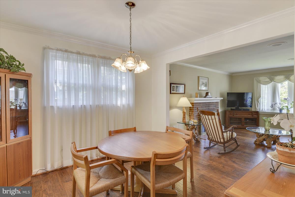 7516 Inzer Street Springfield, VA 22151 - Photo 5 of 30 a view of a dining room with furniture window and wooden floor