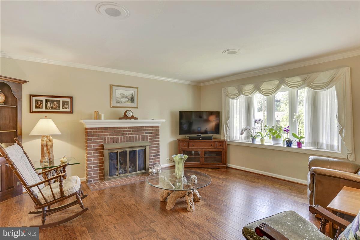7516 Inzer Street Springfield, VA 22151 - Photo 6 of 30 a living room with furniture fireplace and window