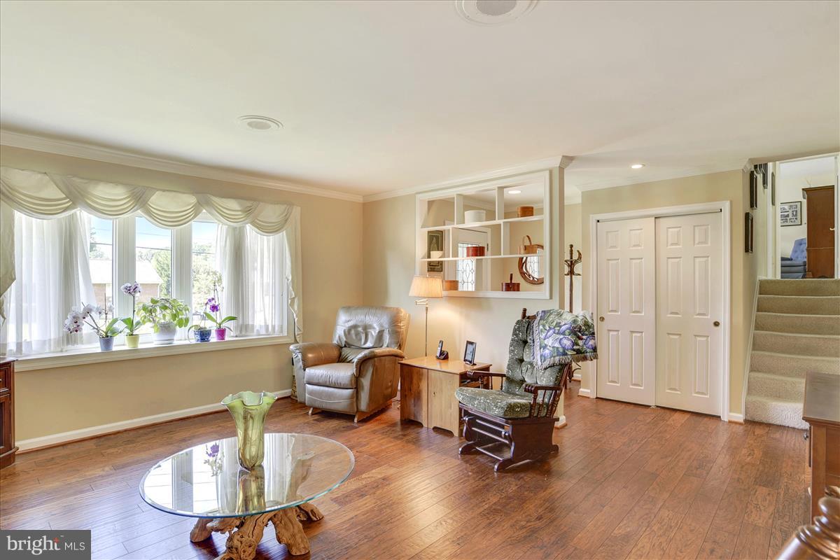 7516 Inzer Street Springfield, VA 22151 - Photo 7 of 30 a living room with furniture and a large window