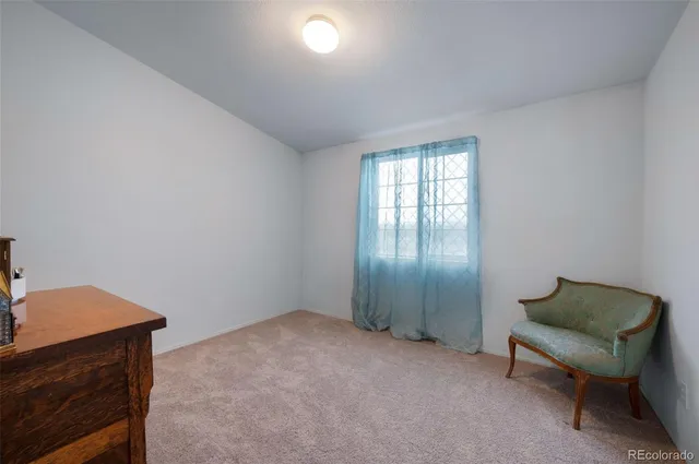 a view of livingroom with furniture and a window