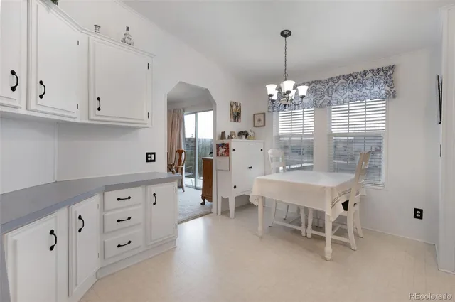a kitchen that has a lot of windows in it