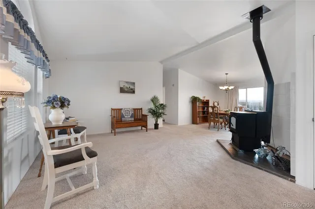 a view of a livingroom with furniture and a flat screen tv