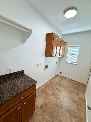 a living room with a stove and a window