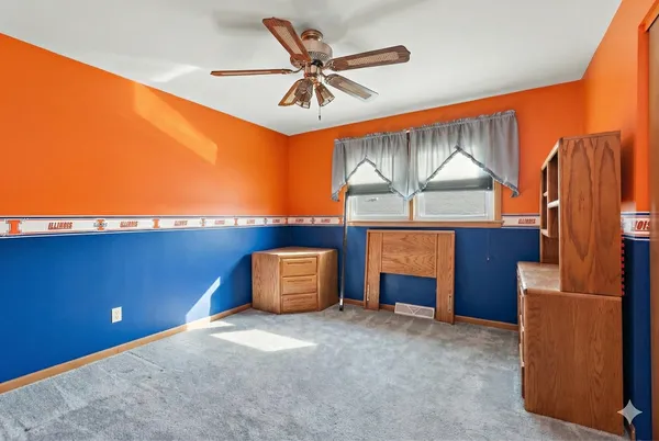 a house view with a fireplace and a projector