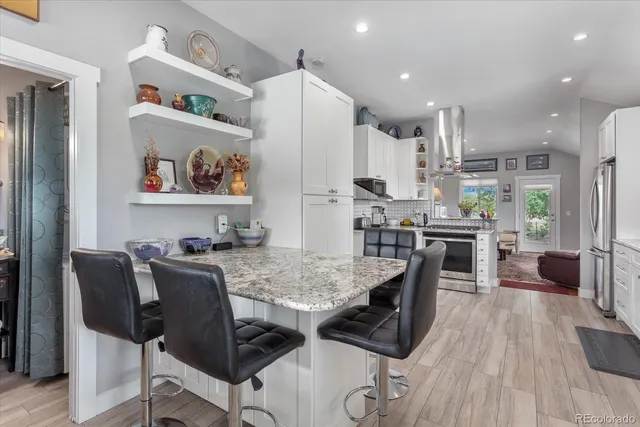 a view of kitchen and dining area with furniture