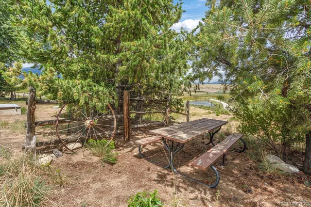 a view of a backyard with chairs