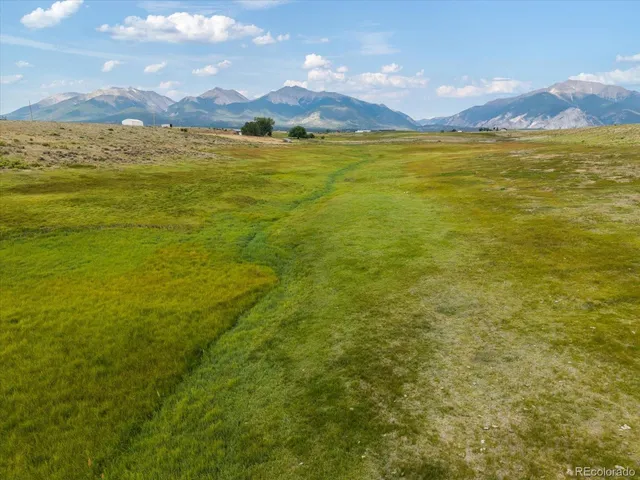 a view of a yard with a mountain