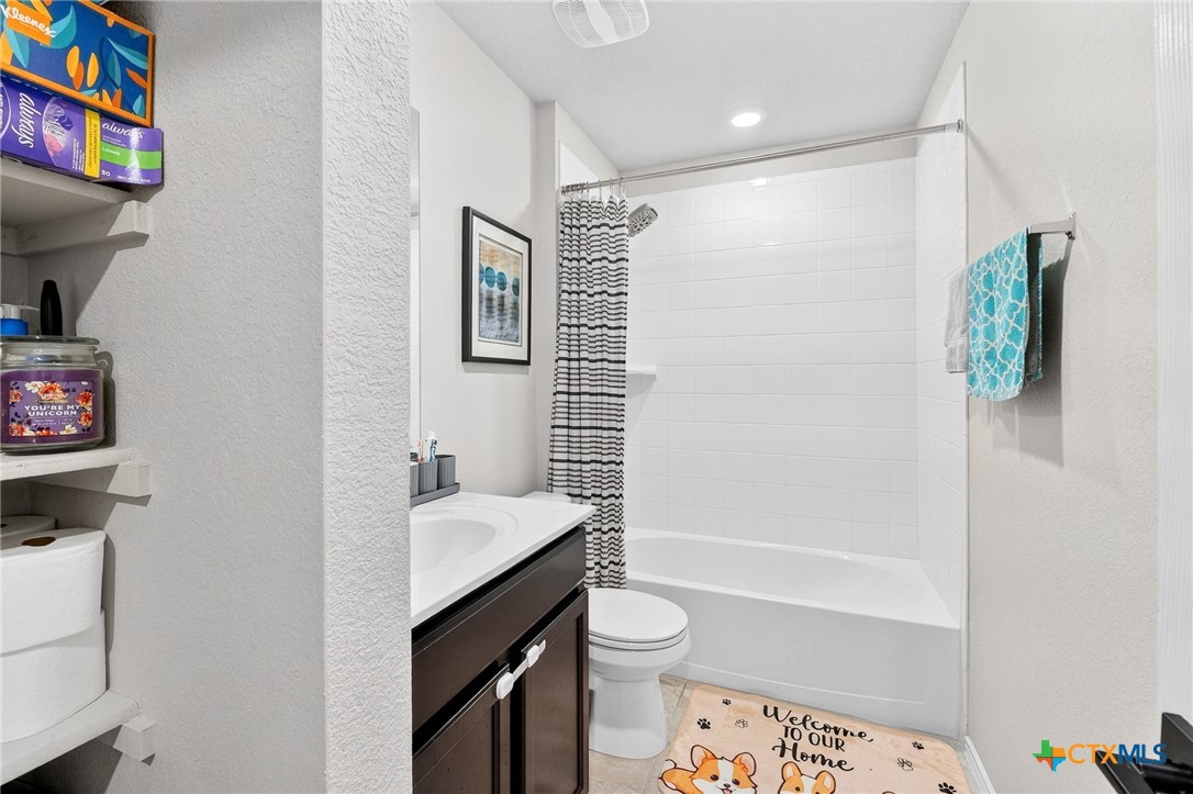 5102 Vivien Street Killeen, TX 76549 - Photo 13 of 23 a bathroom with a sink toilet and shower