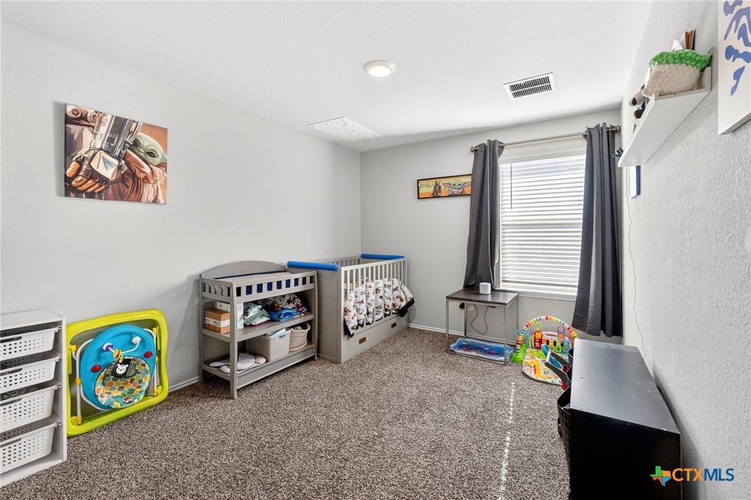 5102 Vivien Street Killeen, TX 76549 - Photo 15 of 23 a bedroom with bed and a window