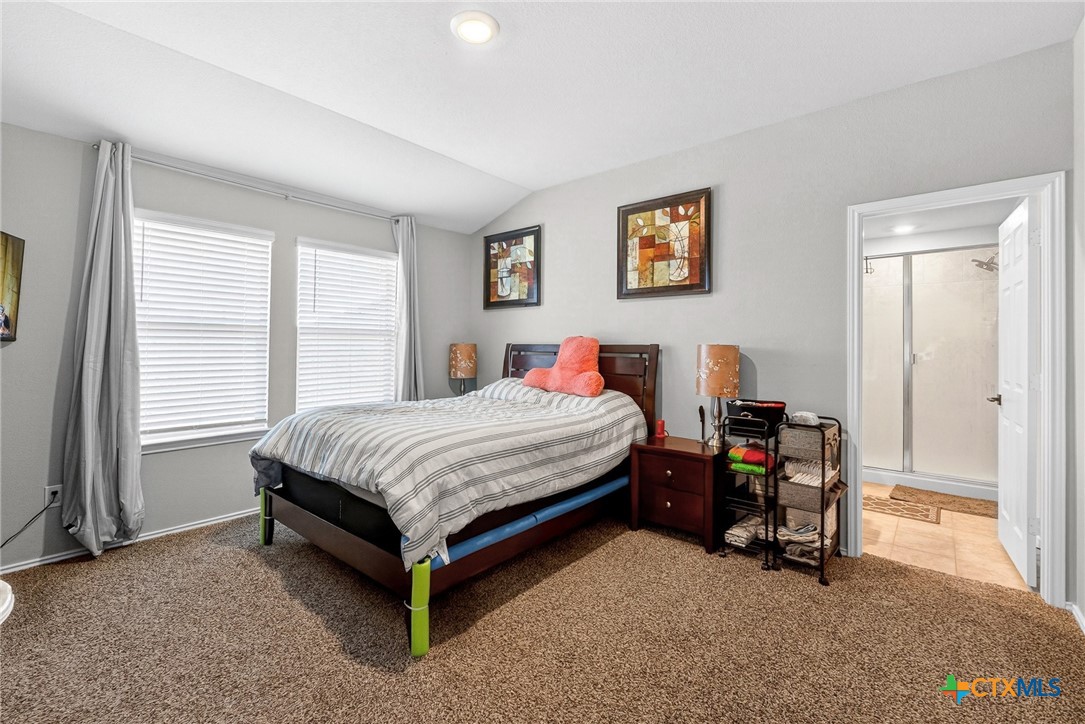 5102 Vivien Street Killeen, TX 76549 - Photo 17 of 23 a bedroom with a bed and a chair in it