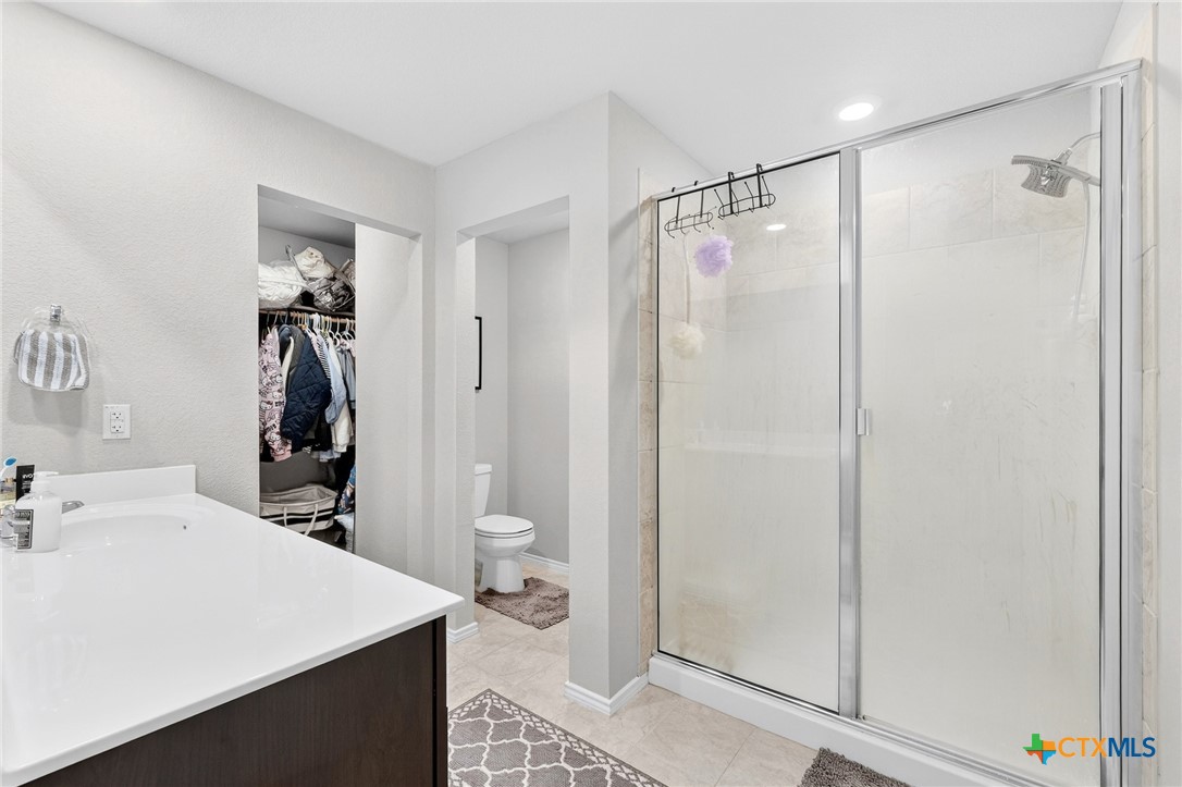 5102 Vivien Street Killeen, TX 76549 - Photo 19 of 23 a bathroom with a sink a toilet and shower