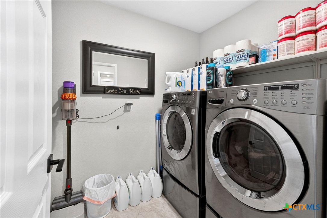 5102 Vivien Street Killeen, TX 76549 - Photo 20 of 23 a view of a storage and utility room with washer and dryer