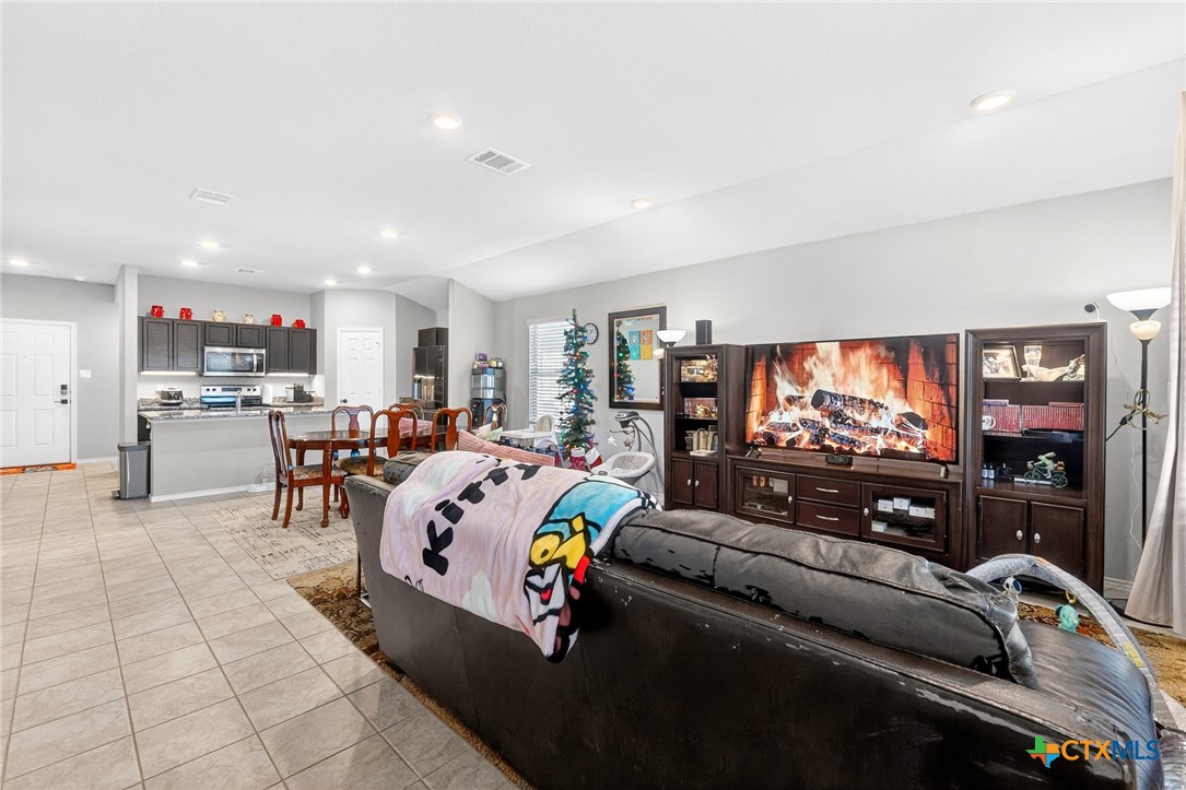 5102 Vivien Street Killeen, TX 76549 - Photo 6 of 23 a living room with furniture and a flat screen tv