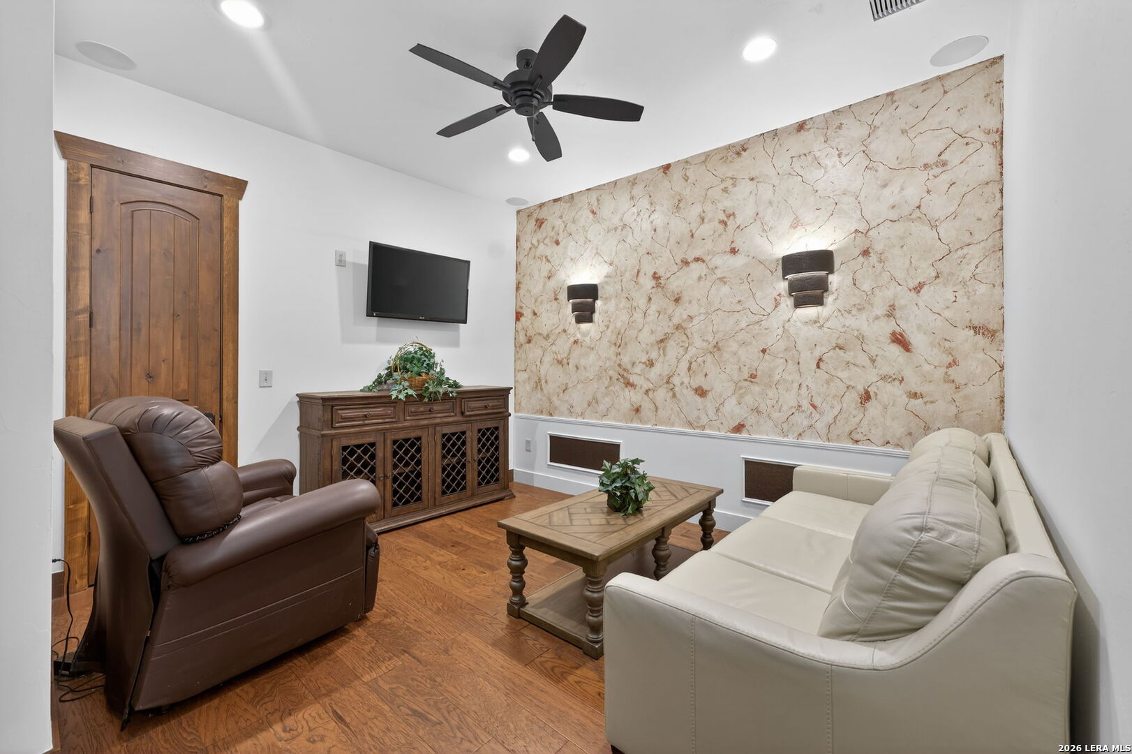 134 Bandit Beach Road New Braunfels, TX 78130 - Photo 22 of 77 a living room with furniture and a wooden floor