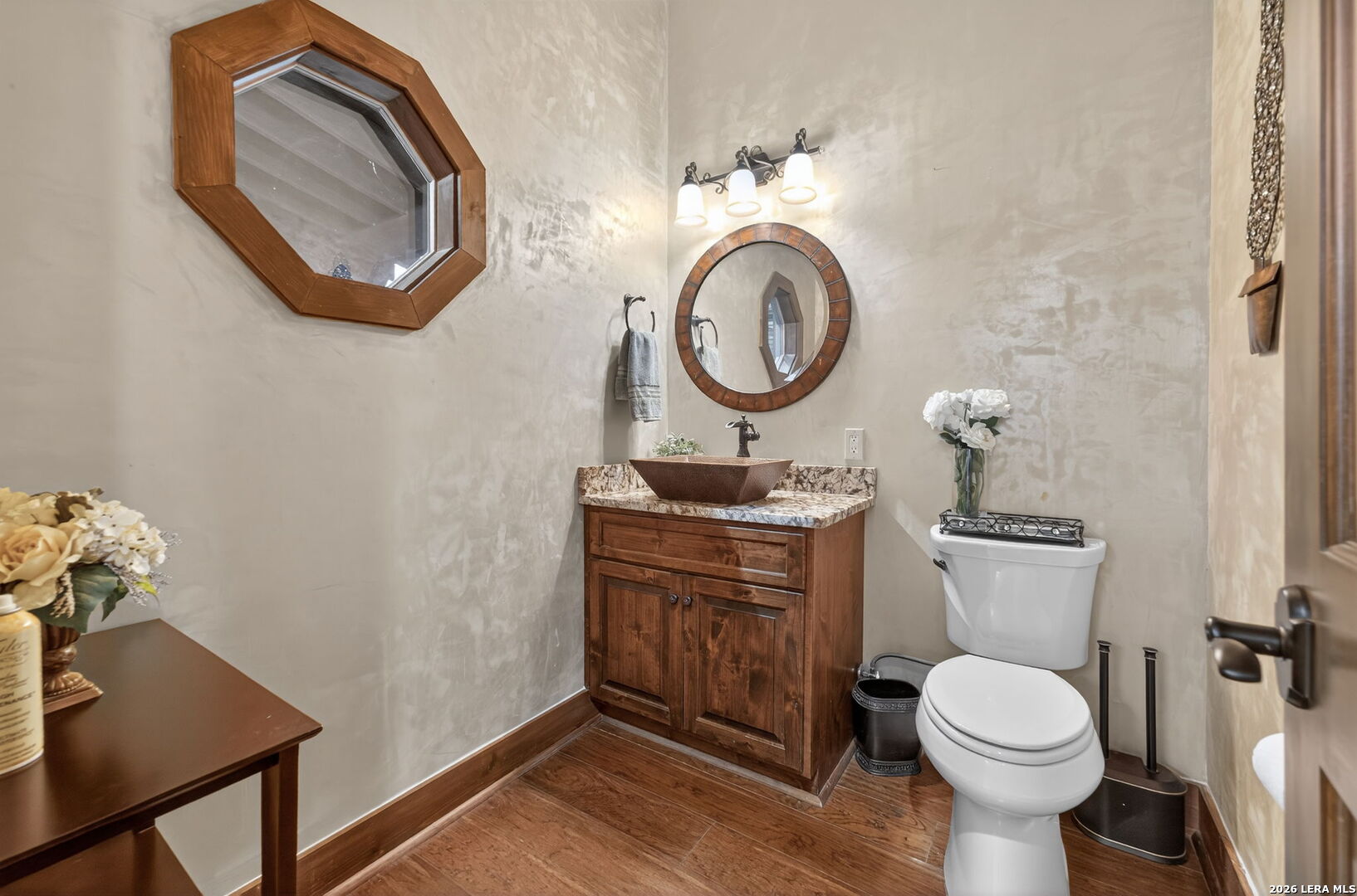 134 Bandit Beach Road New Braunfels, TX 78130 - Photo 23 of 77 a bathroom with a toilet a sink and a mirror
