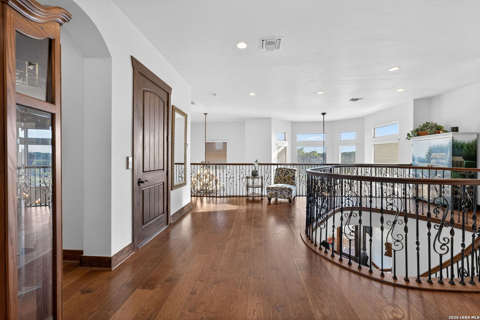 134 Bandit Beach Road New Braunfels, TX 78130 - Photo 27 of 77 a view of a hallway with wooden floor and furniture