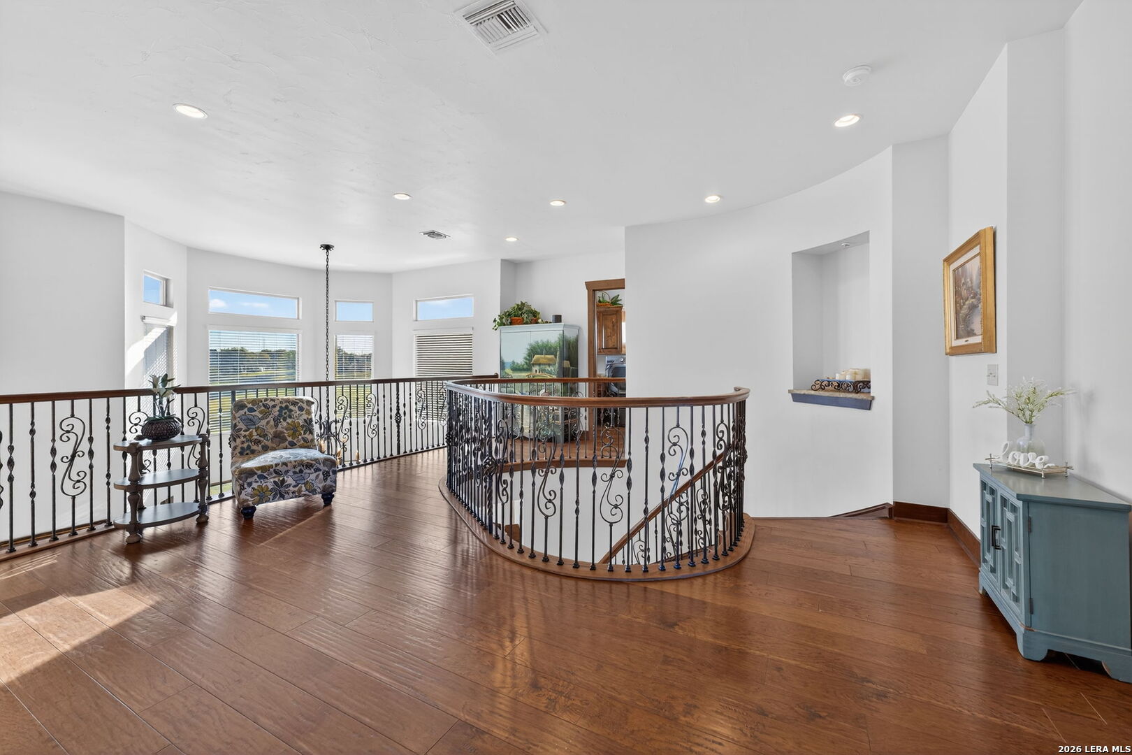 134 Bandit Beach Road New Braunfels, TX 78130 - Photo 28 of 77 a view of a hallway with wooden floor and dining room