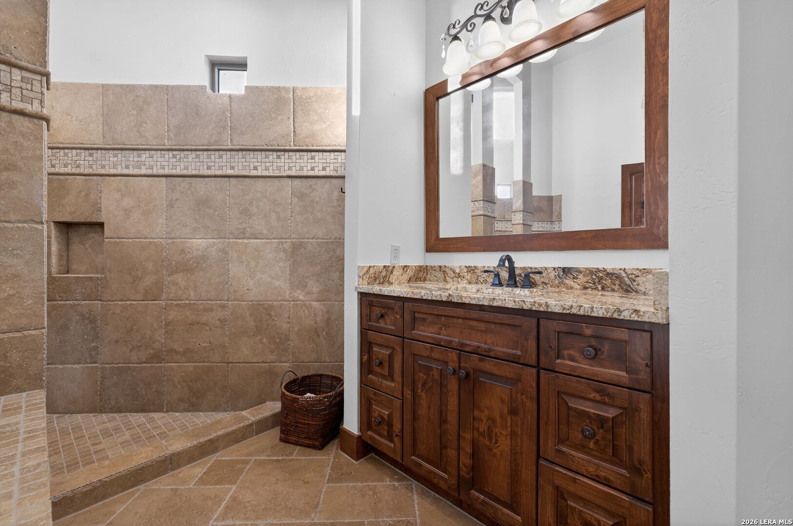 134 Bandit Beach Road New Braunfels, TX 78130 - Photo 50 of 77 a bathroom with a granite countertop sink a mirror and a