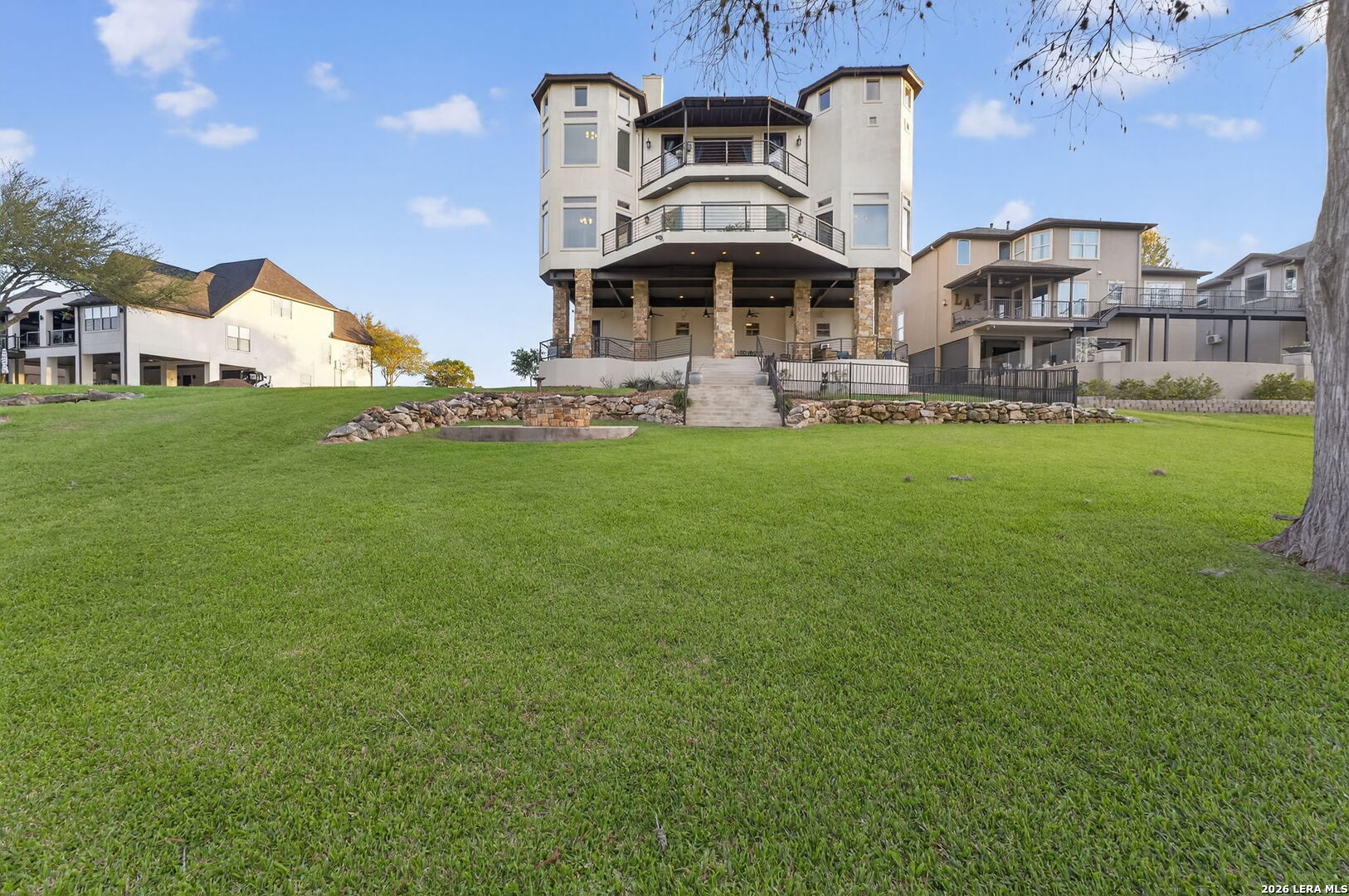 134 Bandit Beach Road New Braunfels, TX 78130 - Photo 64 of 77 a front view of a building with a garden and plants