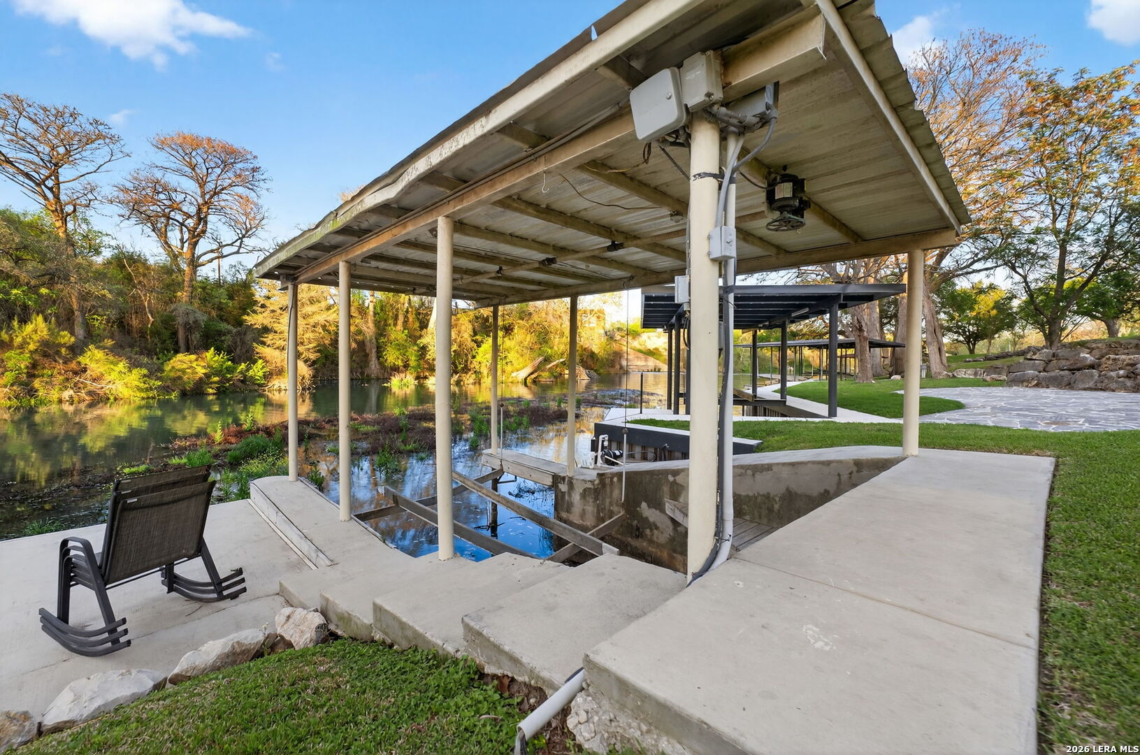 134 Bandit Beach Road New Braunfels, TX 78130 - Photo 66 of 77 a view of a patio with a table and chairs