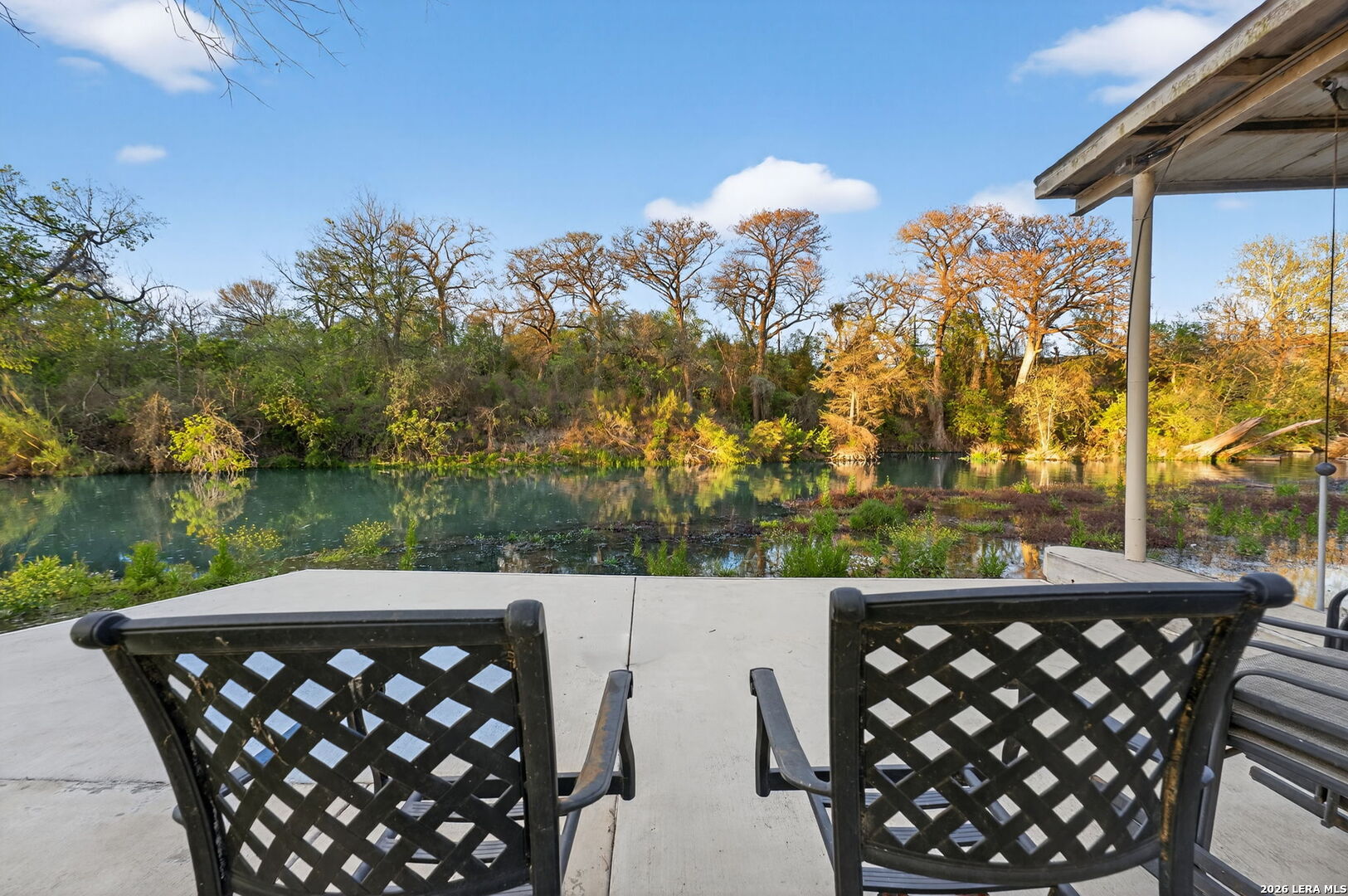 134 Bandit Beach Road New Braunfels, TX 78130 - Photo 68 of 77 a view of a roof deck with couches and wooden fence