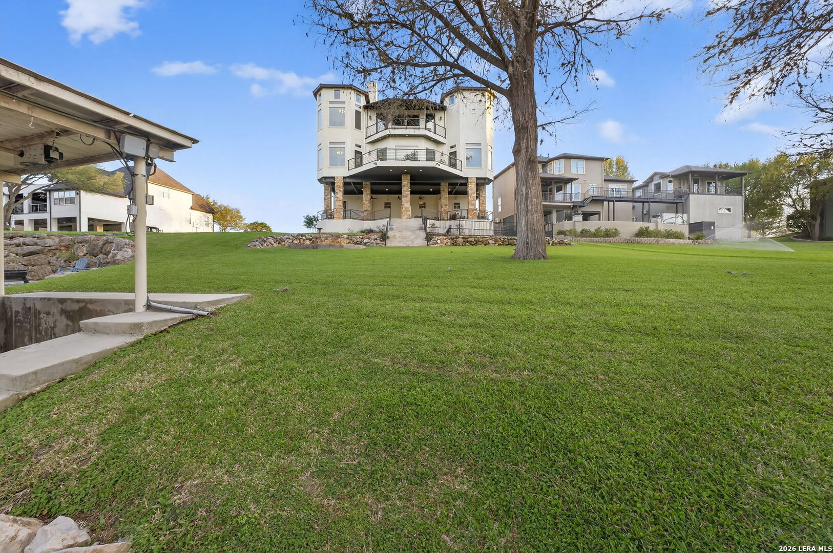 134 Bandit Beach Road New Braunfels, TX 78130 - Photo 72 of 77 a view of a big building with big yard and large trees
