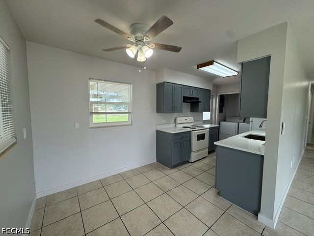26 Alabama Road South Lehigh Acres, FL 33936 - Photo 3 of 10 a room with kitchen island a sink a stove and cabinets