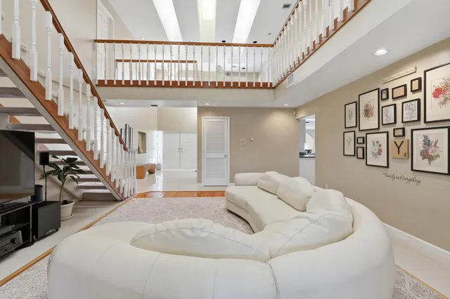 a view of a dining room with furniture and a potted plant
