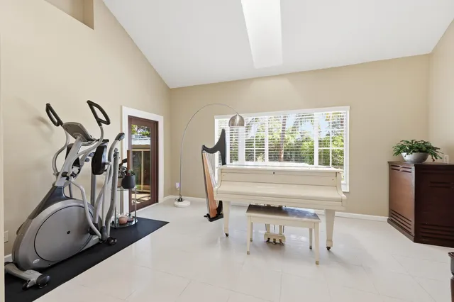 a large white bathroom with a large tub and sink