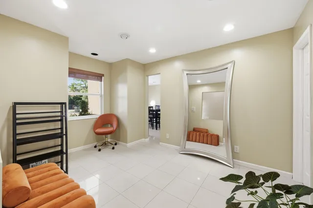 a living room with furniture fireplace and a flat screen tv