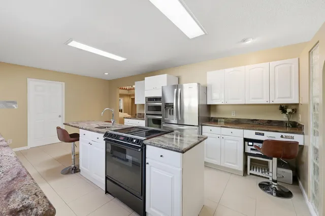 a spacious bedroom with a bed and a window