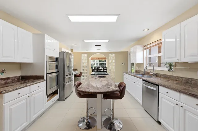 a spacious bathroom with a double vanity sink mirror and double