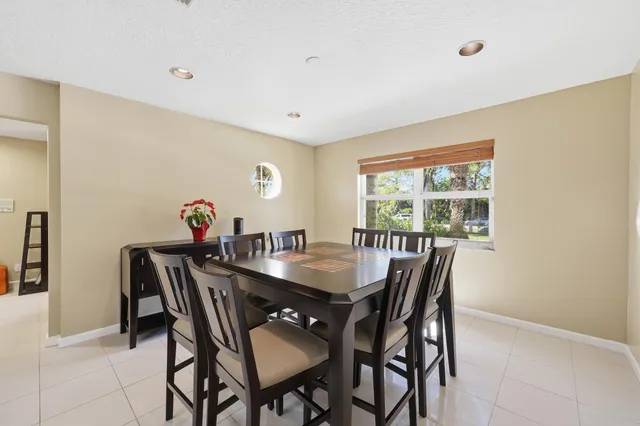 an aerial view of residential house with an outdoor space and seating