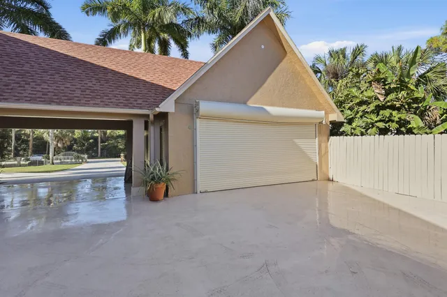 a living room with furniture a window and a dining table