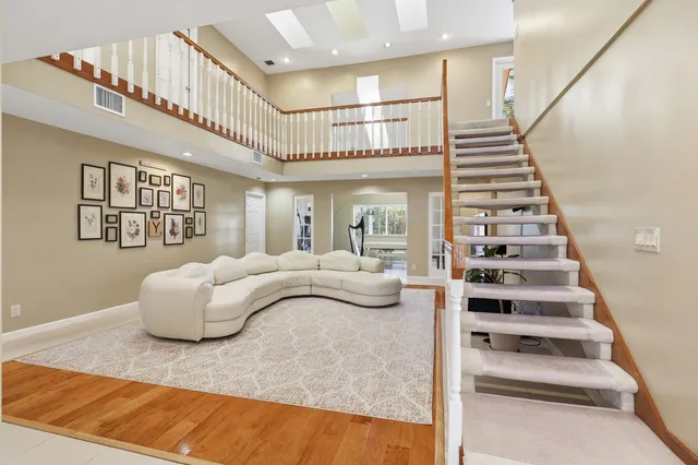 a kitchen with stainless steel appliances kitchen island granite countertop a sink and cabinets