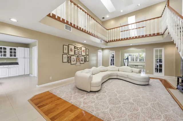 a kitchen with stainless steel appliances kitchen island granite countertop a sink and cabinets