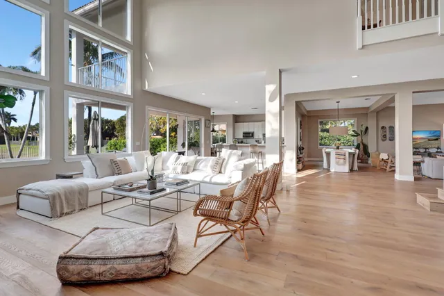 a kitchen with stainless steel appliances kitchen island granite top and refrigerator