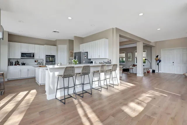 a kitchen with sink and cabinets