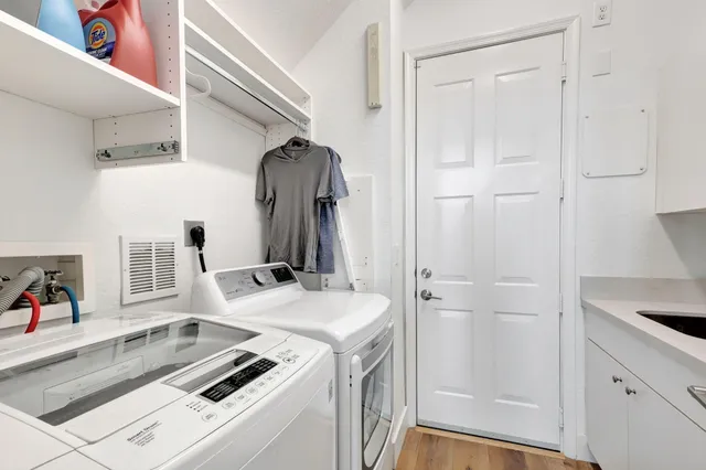 a bedroom with furniture and wooden floor